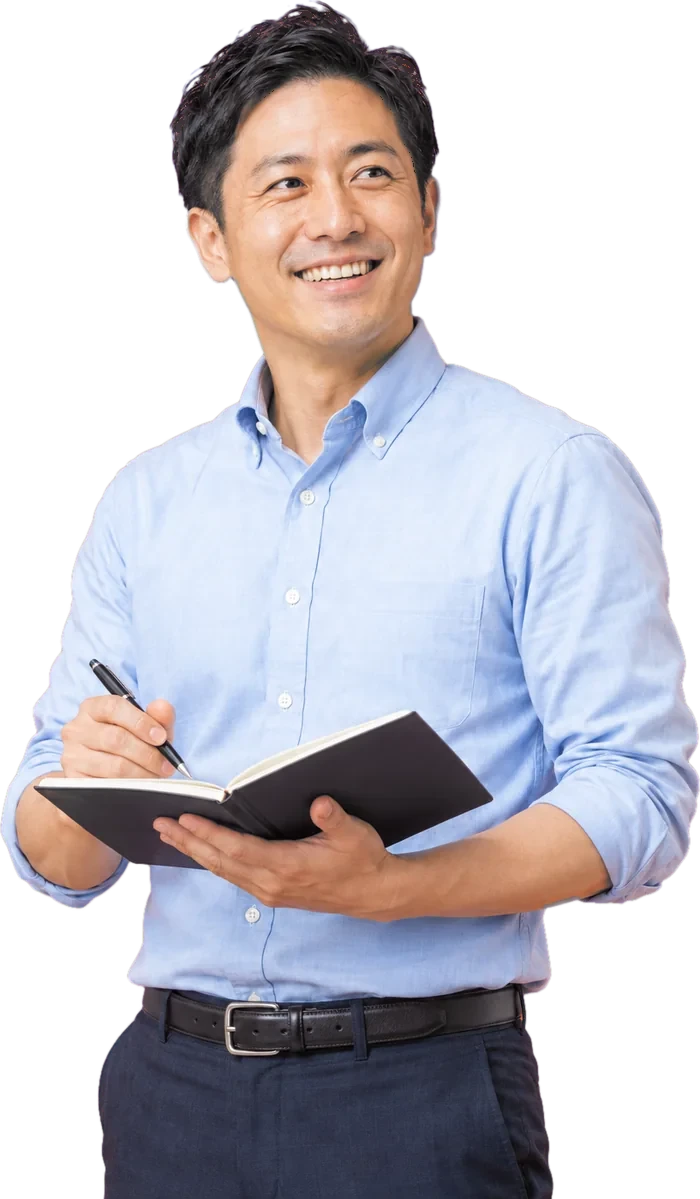 ノートを手にした経営者